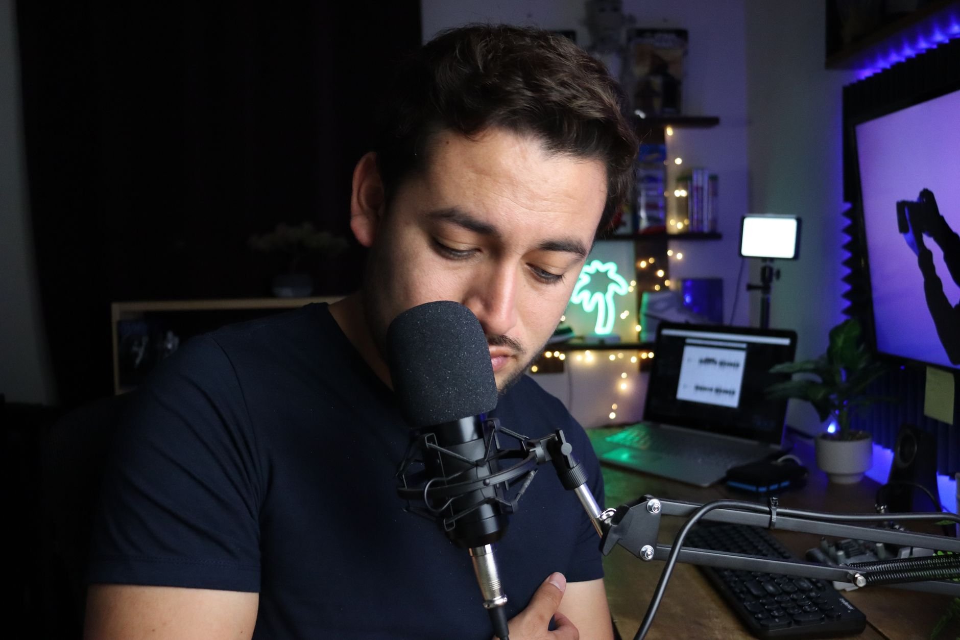 Man recording podcast in a modern home studio